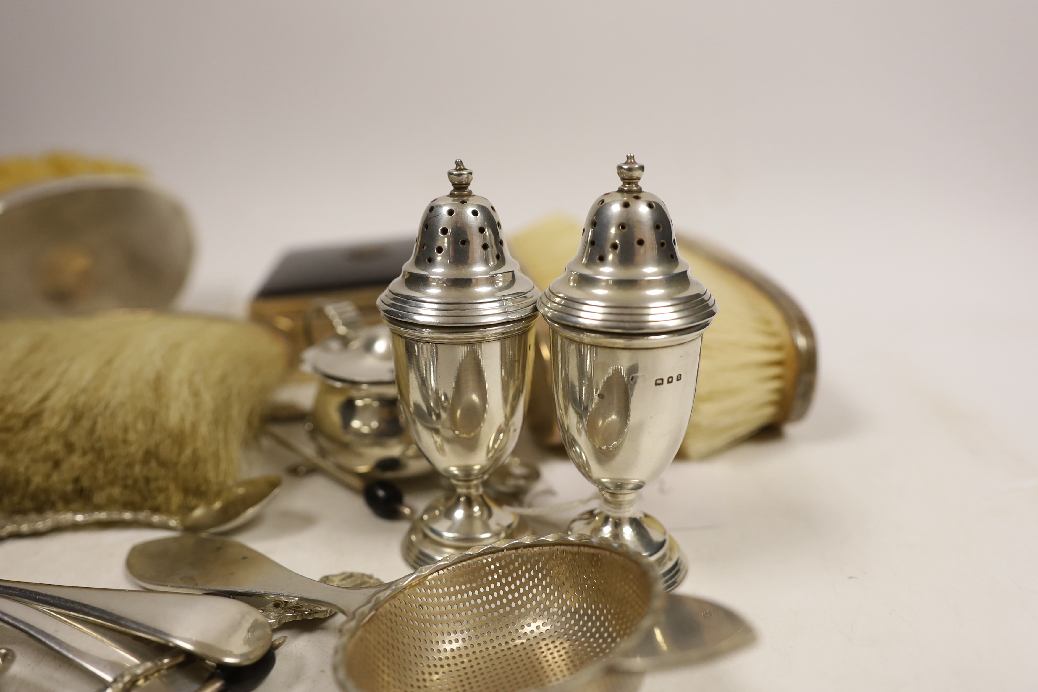 Sundry small silver including flatware, mounted clothes brushes, condiments and mounted cigarette box.